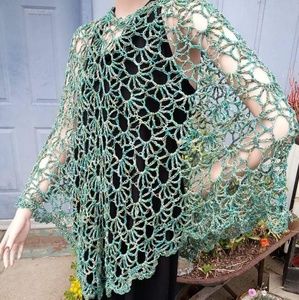 Gorgeous crocheted poncho in beautiful sea greens